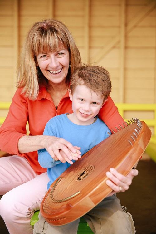 Julie with a boy and harp