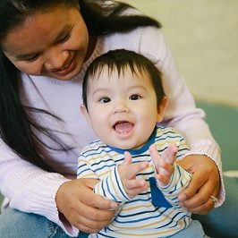 happy baby with mum