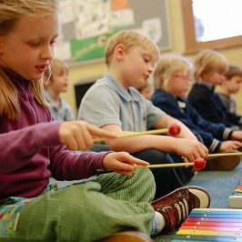 class of children on glockenspiels