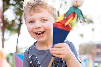 happy boy with a puppet
