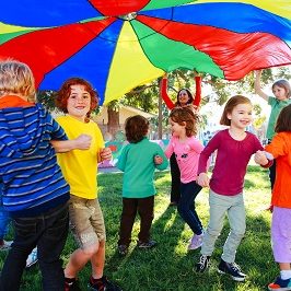 kids playing with a parachute